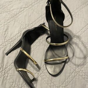 Bebe Black and Gold Heels